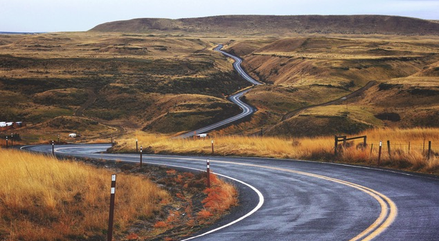 windy paved road in the fall